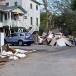 Debris piled outside homes illustrates the extent of the destruction the relief team encountered on their previous trips to the area.