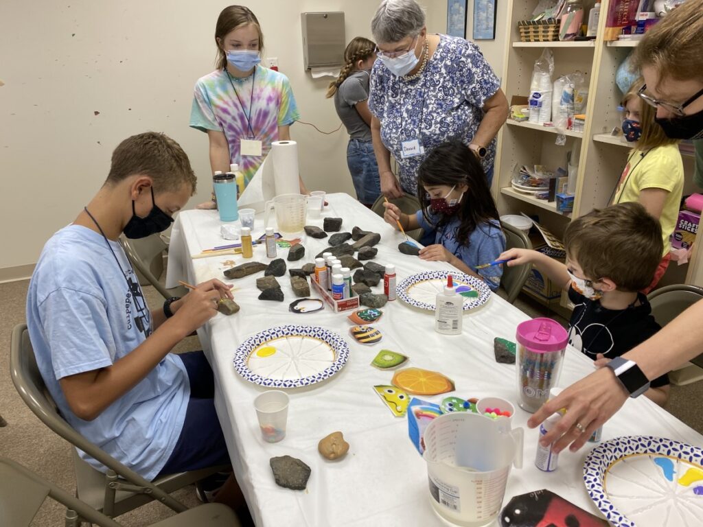 Youth paint rocks at one Sonrise Saturday meeting.